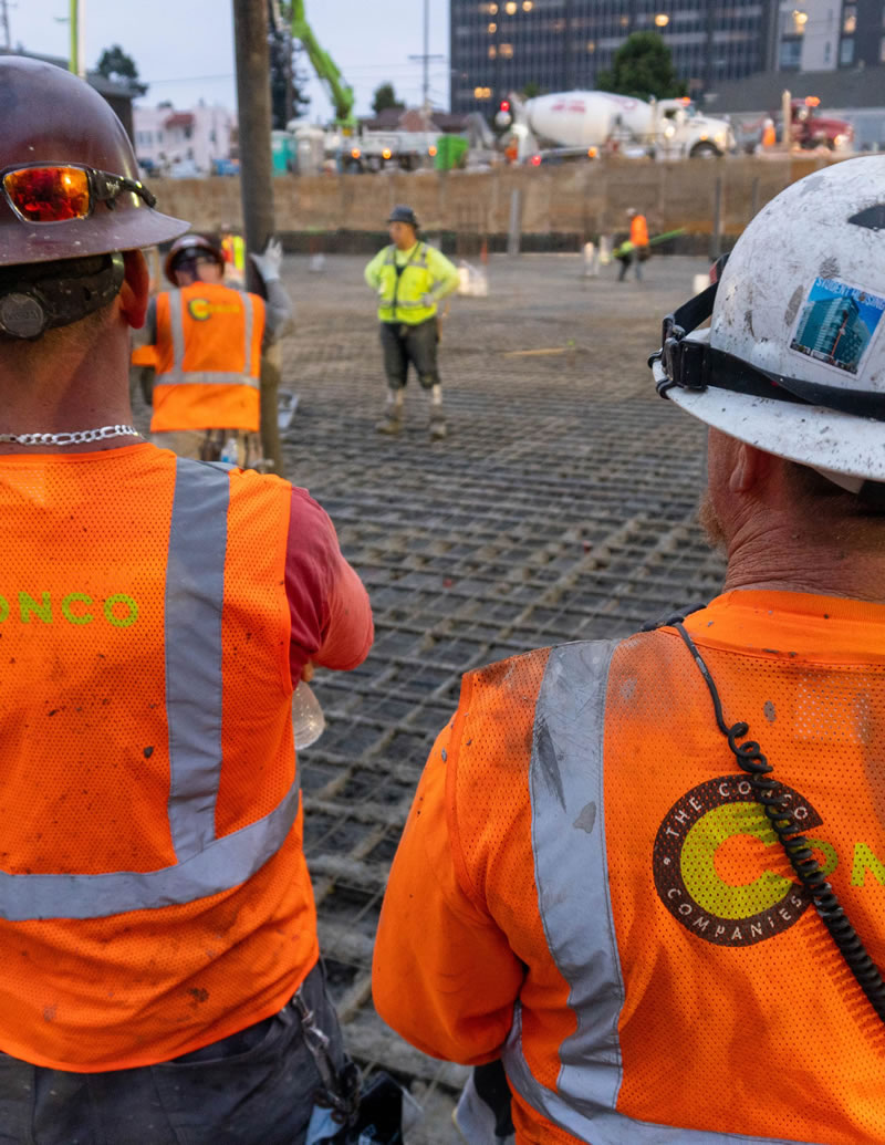 Conco workers in orange vests